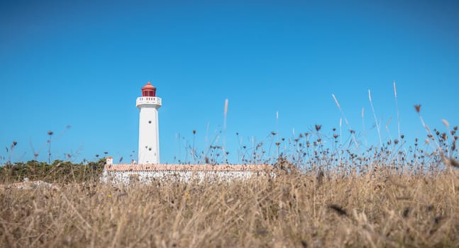 Port Joinville, France - September 17, 2018 - Architectural detail of the Corbeaux Marine Lighthouse on a summer day