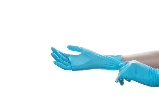 Woman hand wearing a blue rubber medical glove on white isolated background.