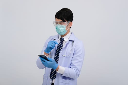 doctor physician practitioner wearing mask with smartphone & stethoscope on white background. medical professional medicine healthcare concept