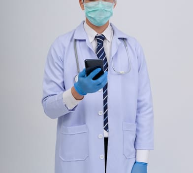 doctor physician practitioner wearing mask with smartphone & stethoscope on white background. medical professional medicine healthcare concept