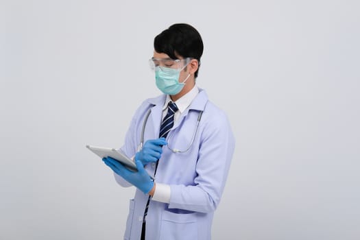 doctor physician practitioner wearing mask with tablet & stethoscope on white background. medical professional medicine healthcare concept