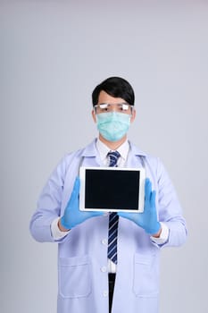 doctor physician practitioner wearing mask with tablet & stethoscope on white background. medical professional medicine healthcare concept
