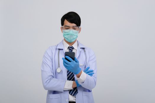 doctor physician practitioner wearing mask with smartphone & stethoscope on white background. medical professional medicine healthcare concept