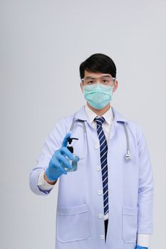 doctor physician practitioner with hand washing alcohol sanitizer dispenser for protecting virus bacteria infection. medical healthcare concept