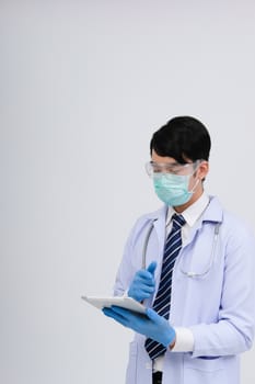 doctor physician practitioner wearing mask with tablet & stethoscope on white background. medical professional medicine healthcare concept