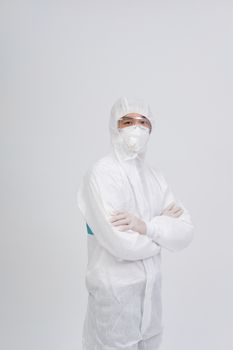man doctor wearing biological protective uniform suit clothing, mask, gloves for preventing virus bacteria infection contamination