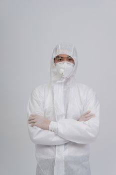 man doctor wearing biological protective uniform suit clothing, mask, gloves for preventing virus bacteria infection contamination