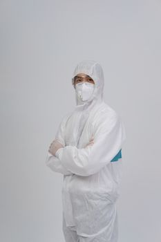 man doctor wearing biological protective uniform suit clothing, mask, gloves for preventing virus bacteria infection contamination