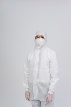 man doctor wearing biological protective uniform suit clothing, mask, gloves for preventing virus bacteria infection contamination