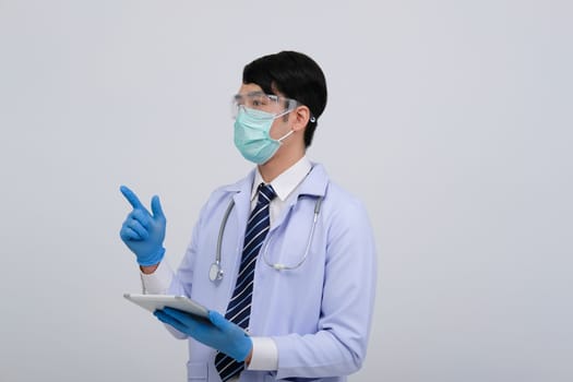 doctor physician practitioner wearing mask with tablet & stethoscope on white background. medical professional medicine healthcare concept