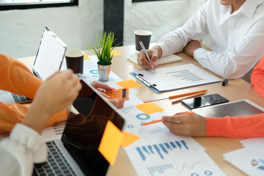 business people discussing on performance revenue in meeting. businessman working with co-worker team. financial adviser analyzing data with investor.