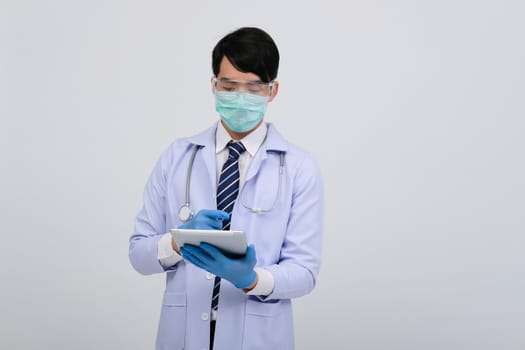 doctor physician practitioner wearing mask with tablet & stethoscope on white background. medical professional medicine healthcare concept
