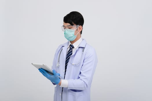 doctor physician practitioner wearing mask with tablet & stethoscope on white background. medical professional medicine healthcare concept