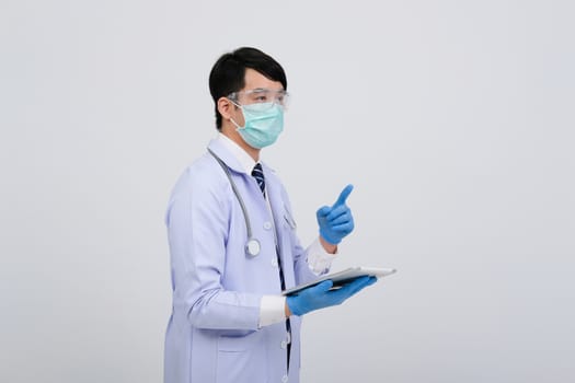 doctor physician practitioner wearing mask with tablet & stethoscope on white background. medical professional medicine healthcare concept