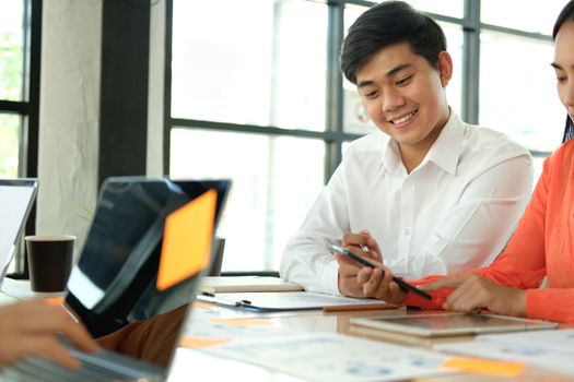 business people discussing on performance revenue in meeting. businessman working with co-worker team. financial adviser analyzing data with investor.