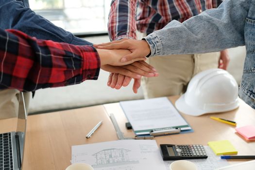 startup man woman joining united hand, business team touching hands together after complete a deal in meeting. unity teamwork partnership corporate concept.