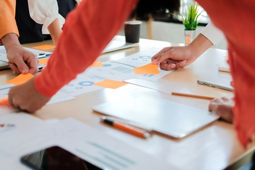 business people discussing on performance revenue in meeting. businesswoman working with co-worker team. financial adviser analyzing data with investor.