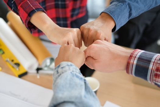 startup man woman joining united hand, business team touching hands together after complete a deal in meeting. unity teamwork partnership corporate concept.