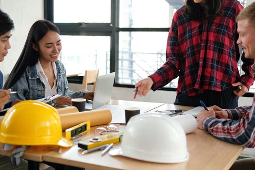 architect engineer interior designer team working discussing on house blueprint of real estate project in meeting. building construction teamwork concept