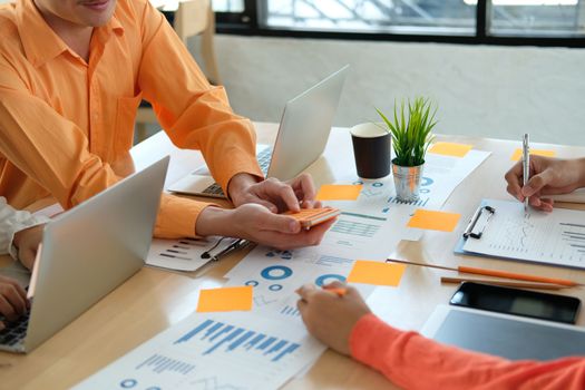 business people discussing on performance revenue in meeting. businessman working with co-worker team. financial adviser analyzing data with investor.