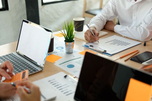 business people discussing on performance revenue in meeting. businessman working with co-worker team. financial adviser analyzing data with investor.