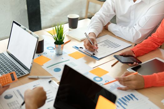 business people discussing on performance revenue in meeting. businessman working with co-worker team. financial adviser analyzing data with investor.