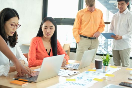 business people discussing on performance revenue in meeting. businessman working with co-worker team. financial adviser analyzing data with investor.