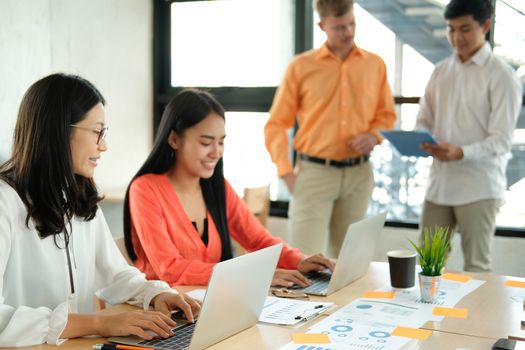 business people discussing on performance revenue in meeting. businessman working with co-worker team. financial adviser analyzing data with investor.