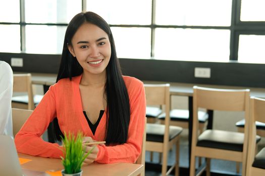 young confident asian executive businesswoman woman smiling at business workplace