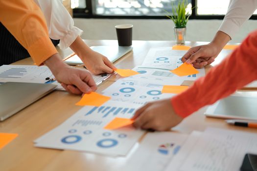 business people discussing on performance revenue in meeting. businesswoman working with co-worker team. financial adviser analyzing data with investor.