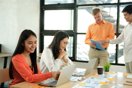 business people discussing on performance revenue in meeting. businessman working with co-worker team. financial adviser analyzing data with investor.