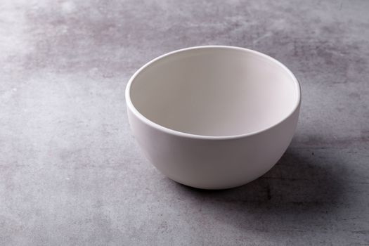 Empty blank white ceramic Bowl on Cement Board.