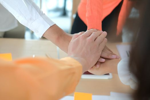 startup man woman joining united hand, business team touching hands together after complete a deal in meeting. unity teamwork partnership corporate concept.