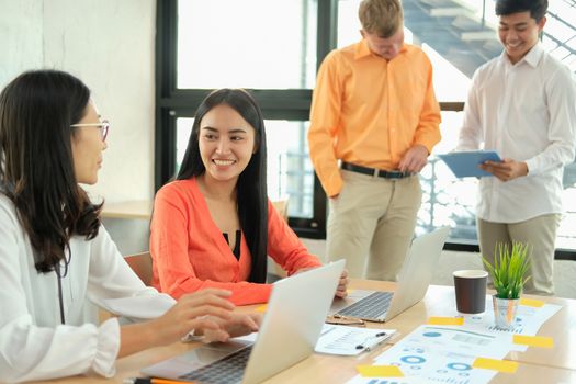 business people discussing on performance revenue in meeting. businessman working with co-worker team. financial adviser analyzing data with investor.