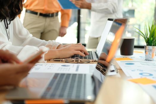 business people discussing on performance revenue in meeting. businessman working with co-worker team. financial adviser analyzing data with investor.