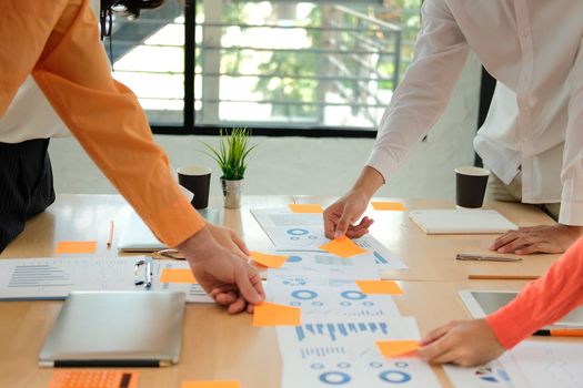 business people discussing on performance revenue in meeting. businesswoman working with co-worker team. financial adviser analyzing data with investor.