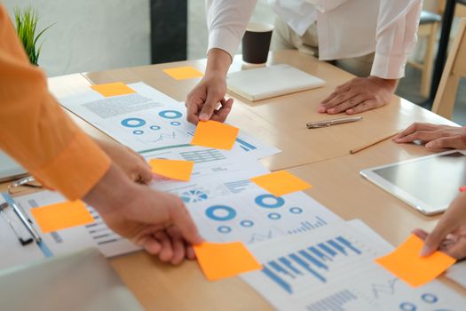 business people discussing on performance revenue in meeting. businesswoman working with co-worker team. financial adviser analyzing data with investor.