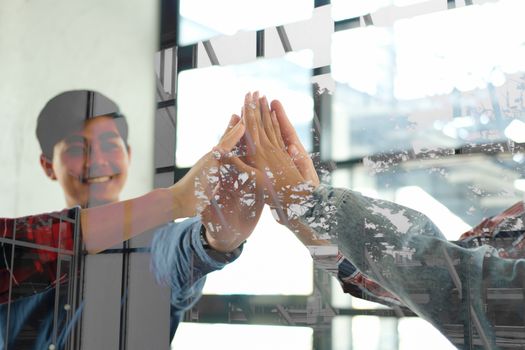 startup man woman joining united hand, business team touching hands together after complete a deal in meeting. unity teamwork partnership corporate concept.