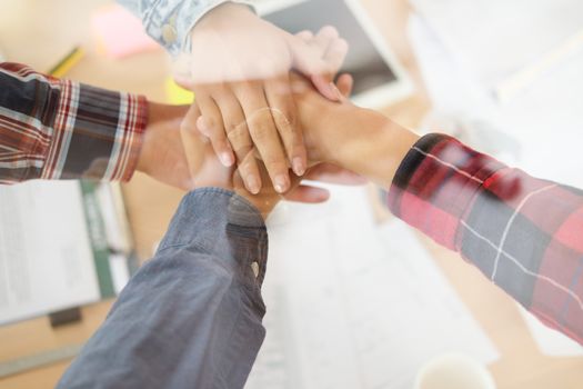 startup man woman joining united hand, business team touching hands together after complete a deal in meeting. unity teamwork partnership corporate concept.