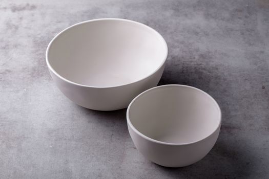 Empty blank white ceramic Bowl on Cement Board.