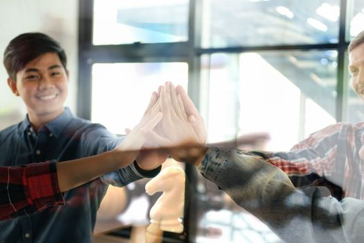 startup man woman joining united hand, business team touching hands together after complete a deal in meeting. unity teamwork partnership corporate concept.