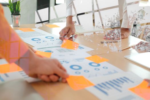 business people discussing on performance revenue in meeting. businesswoman working with co-worker team. financial adviser analyzing data with investor.