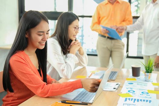 business people discussing on performance revenue in meeting. businessman working with co-worker team. financial adviser analyzing data with investor.