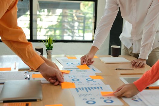 business people discussing on performance revenue in meeting. businesswoman working with co-worker team. financial adviser analyzing data with investor.