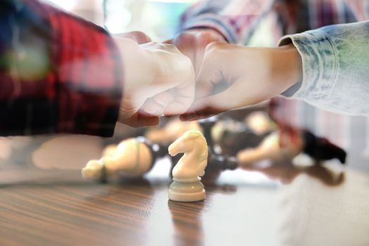 startup man woman joining united hand, business team touching hands together after complete a deal in meeting. unity teamwork partnership corporate concept.