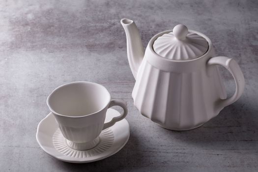 Teapot creamer, Cup and saucer on Cement Board.