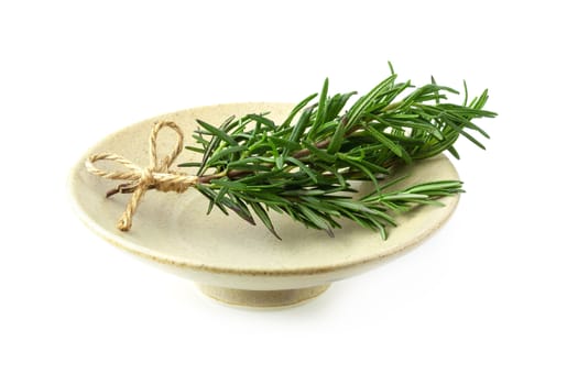 Fresh raw Rosemary isolated on a white background.