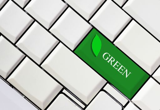 Green key on white keyboard, green concept