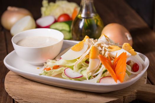 Fresh green salad with chicken and hard-boiled egg Healthy eating.