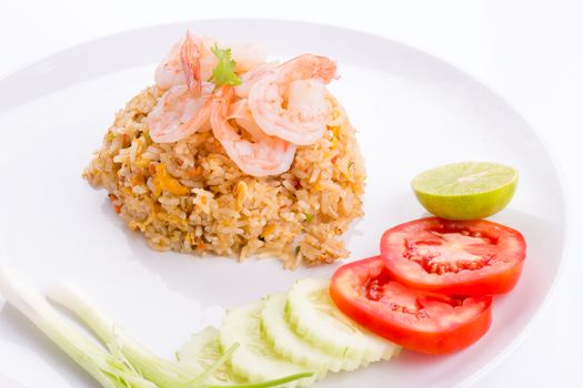 Thai fried rice with prawns in a white plate on whiye background.